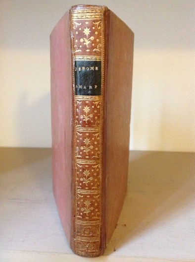 [Decremps, Henri]. Les petites aventures de Jérome Sharp, professeur de physique amusante; Ouvrage contenant autant de tours ingénieux que de leçons utiles, avec quelques petits portraits à la manière noire, par l'auteur de La Magie Blanche. In-8, à Bruxelles chez la veuve Dujardin et à Paris chez Defer de Maisonneuve, demi-basane d'époque, dos orné, piède de titre de maroquin vert, titre doré, tranches jaspées, 386 p., illustré d'un frontispice représentant Jérome Sharp voyageant en habit de chasseur et de 18 figures dans le texte. Célèbre ouvrage, écrit par Henri Decremps (1746-1826) de physique amusante et de prestidigitation sous forme de roman et de livre de voyages : Jérôme Sharp, ruiné, forme le projet de partir pour Paris et pour Londres et en route pratique, au grès des rencontres, la récréation mathématique et physique.  Petite mouillure au bas du frontispice, sinon très bon état. Bel ex libris du chevalier de Lacalprenede avec le cordon et la Croix de l'Ordre royal et militaire de Saint-Louis.   